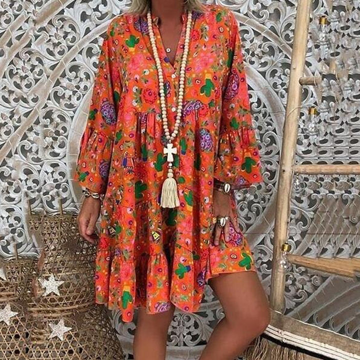 Women's A-line tunic mini dress with V-neck, tiered ruffles, and Boho bandana print StylebySassy