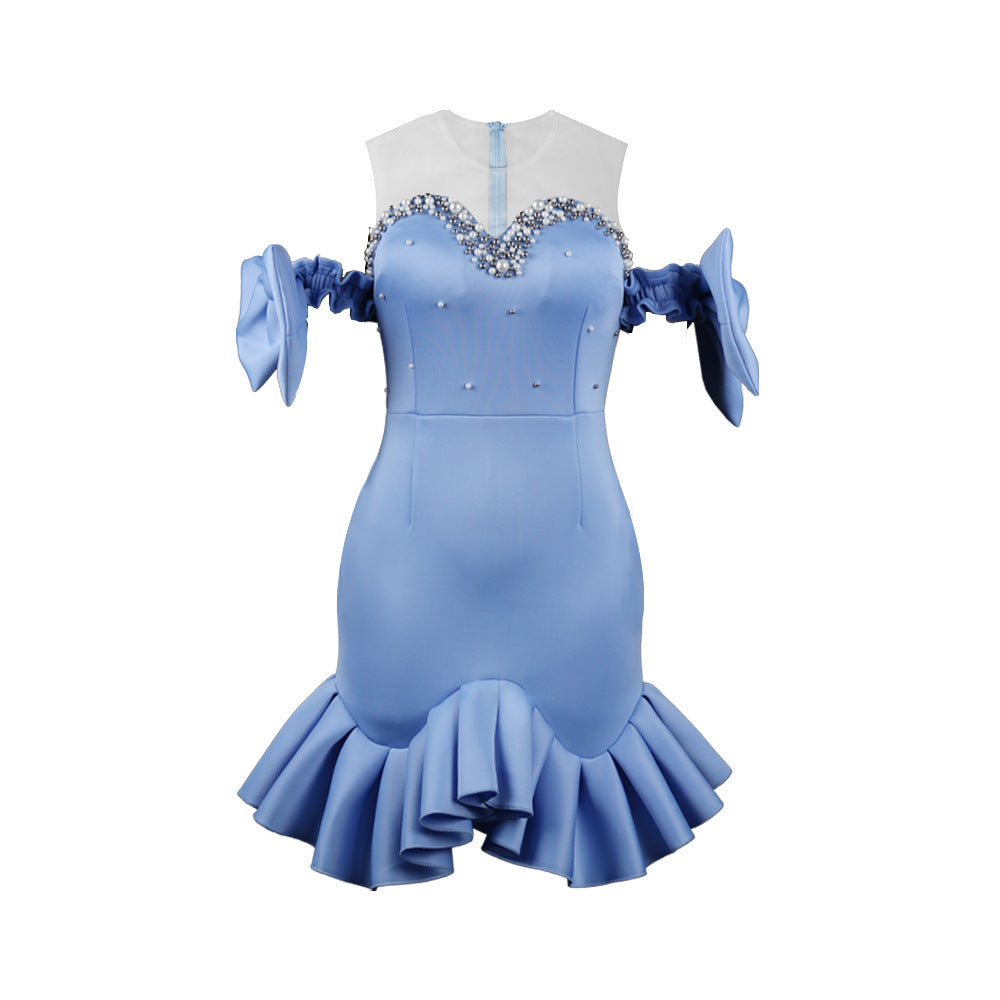 Ladies glamorous cocktail dress with transparent puff sleeves and ruffled hem