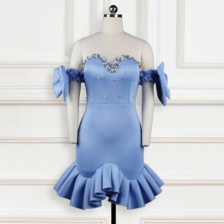 Ladies glamorous cocktail dress with transparent puff sleeves and ruffled hem
