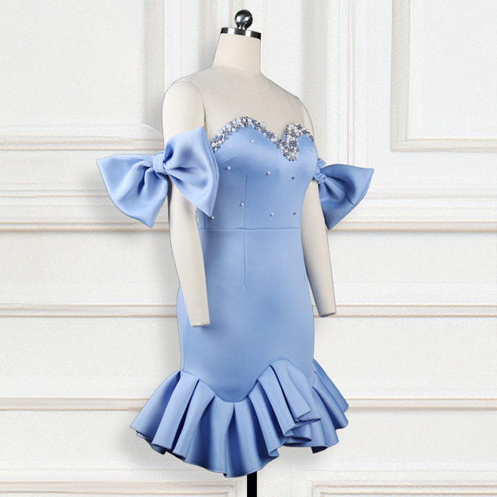 Ladies glamorous cocktail dress with transparent puff sleeves and ruffled hem
