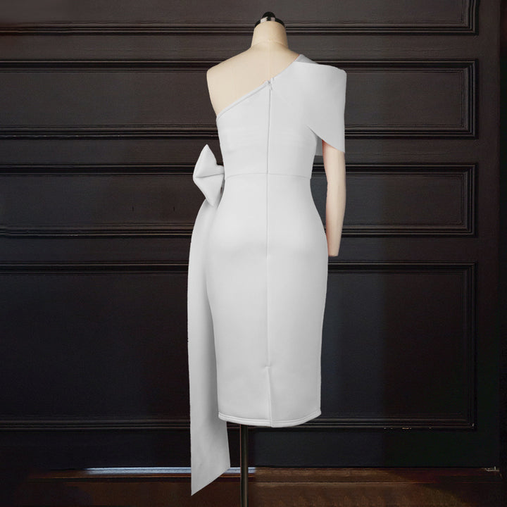 Women figure-hugging evening dress with asymmetric neckline and voluminous bow accent StylebySassy