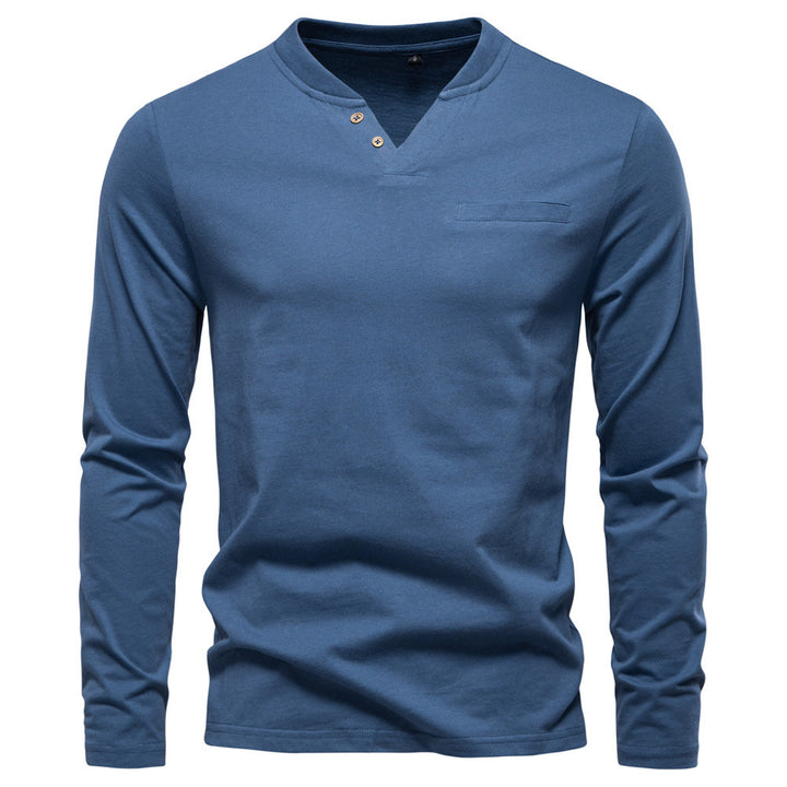 Men's tailored long sleeve shirt in Henley style with short V-neck, decorative buttons, and chest pocket StylebySassy