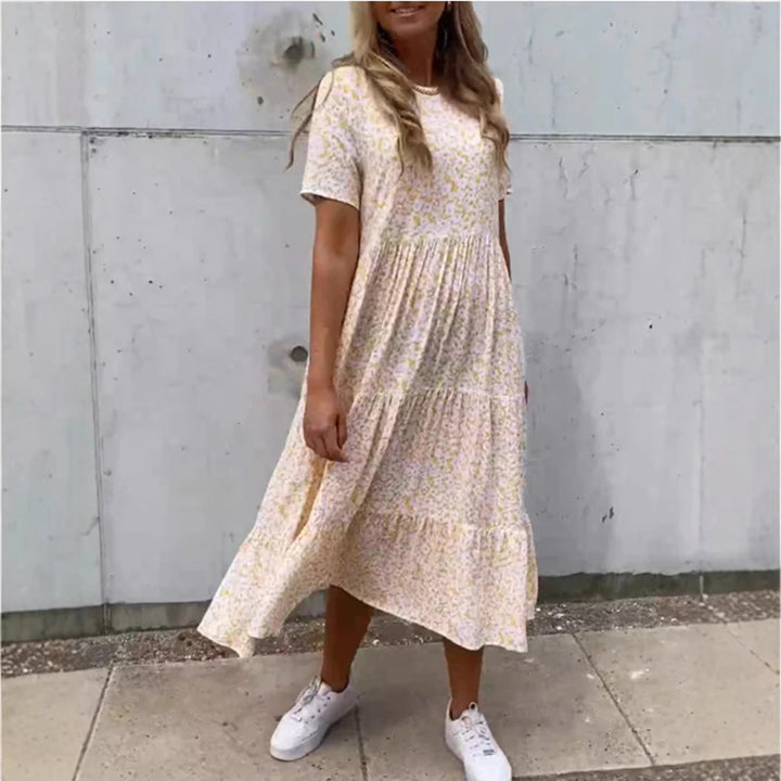 Women's flowing tiered maxi dress in Boho babydoll style with gathered underbust and short sleeves StylebySassy