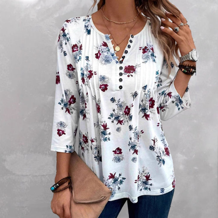 Women's floral tunic blouse with pleats and decorative button placket StylebySassy