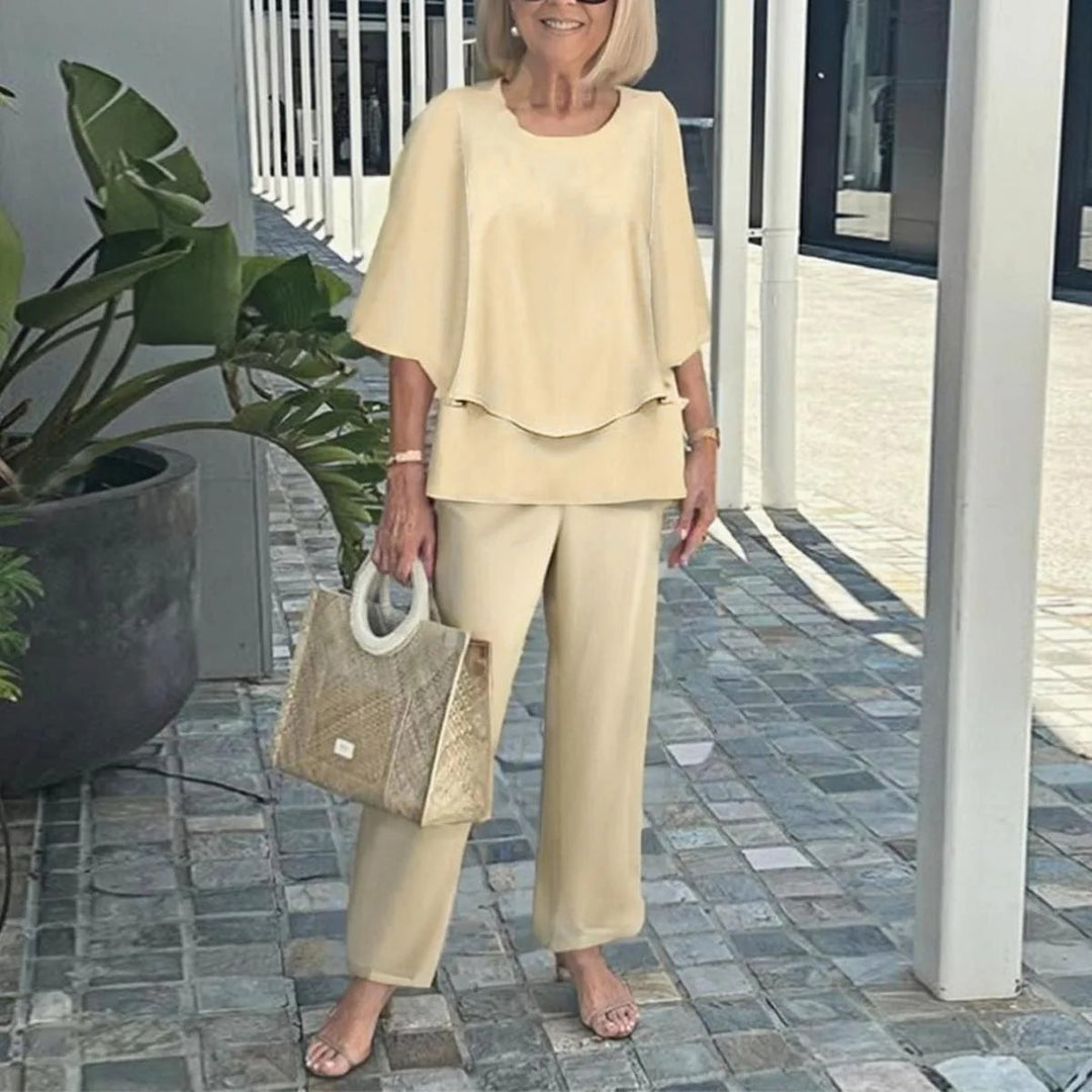 Women's layered tunic with cape sleeves and ankle-length straight leg pants with graphic print StylebySassy