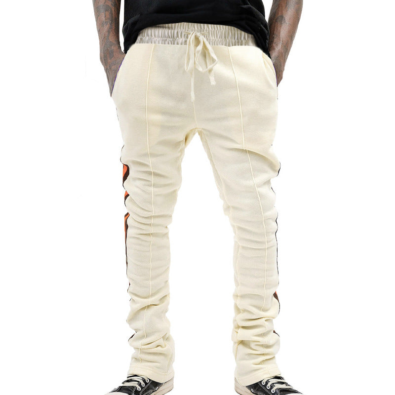 Men's slim-fit casual pants with drawstring, decorative seams, and side contrast stripe StylebySassy