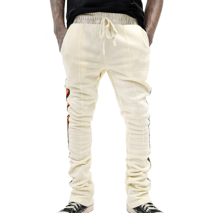 Men's slim-fit casual pants with drawstring, decorative seams, and side contrast stripe StylebySassy