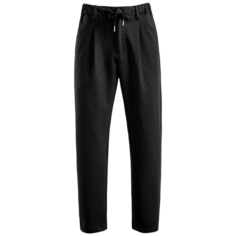 Men's pleated jogger-style trousers with drawstring, belt loops, and tapered cut StylebySassy