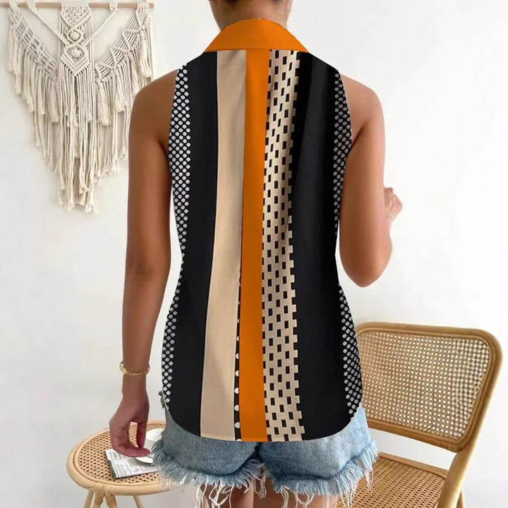 Women's sleeveless shirt top with pointed collar, contrasting button placket and geometric dot and stripe pattern StylebySassy