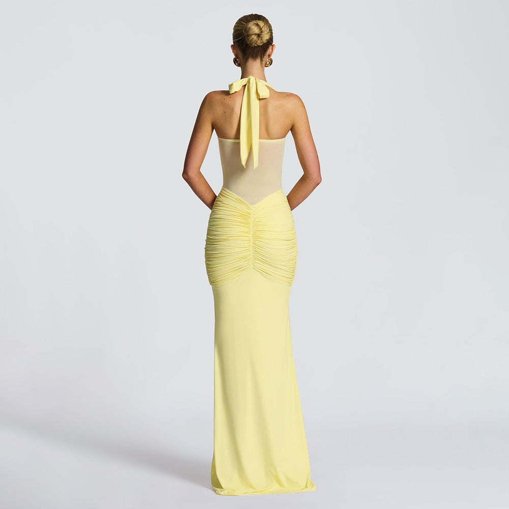 Women's figure-hugging halter evening dress with transparent mesh insert and gathered hip area StylebySassy