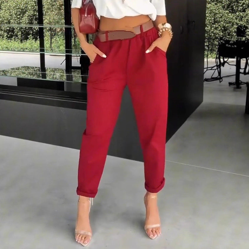 Women's high-waisted paperbag pants with gathered waistband, side pockets, and rolled hem StylebySassy