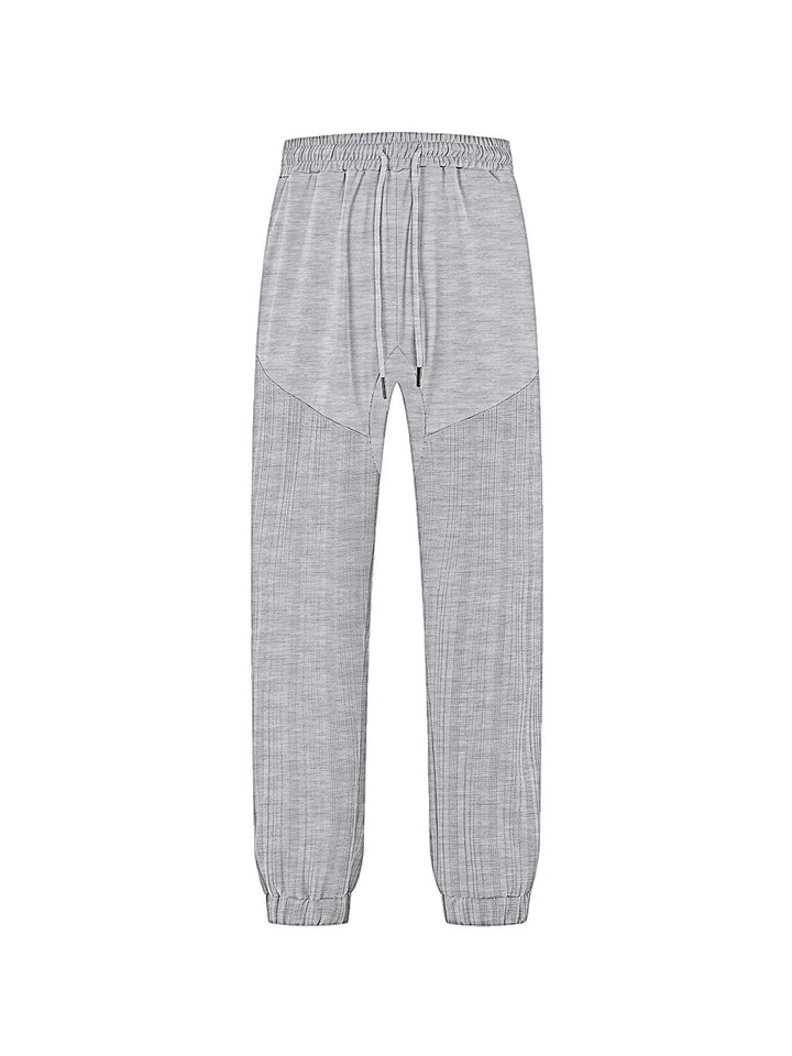 Men's slim-fit jogging pants with elastic drawstring waistband and textured knee panel StylebySassy