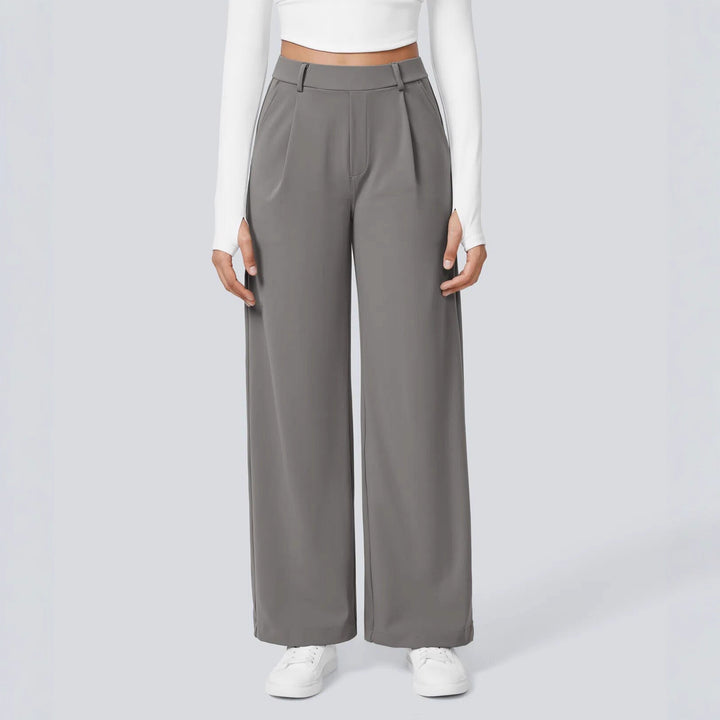 Ladies high-waisted pleated trousers with wide leg, belt loops and side pockets StylebySassy