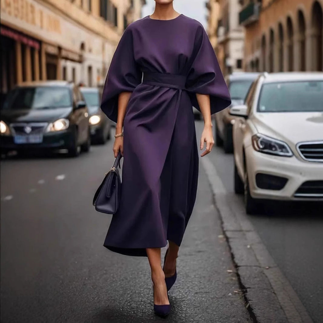 Women's minimalist evening dress with overlong wide sleeves and waist-sculpting pleat draping StylebySassy