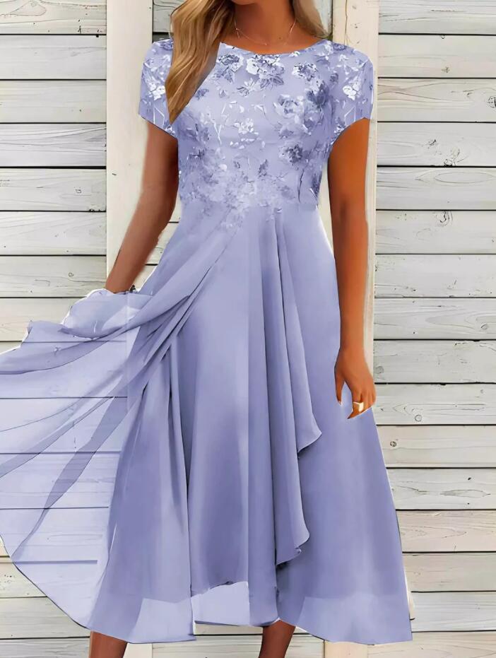 Women's flowing chiffon mid dress with floral embroidered top and asymmetrical tiered skirt StylebySassy