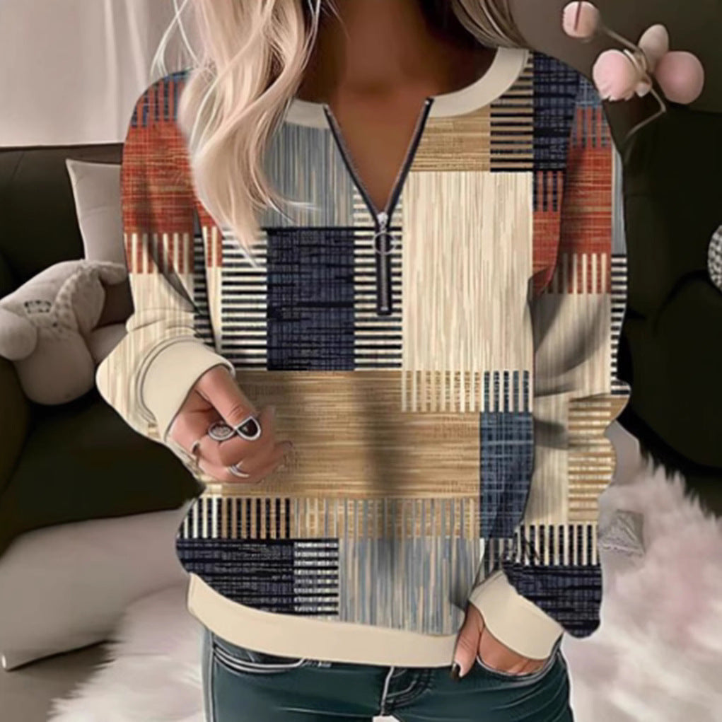 Women's cozy sweater with short zip, graphic patchwork pattern, extended sleeve cuffs, and ribbed hem StylebySassy