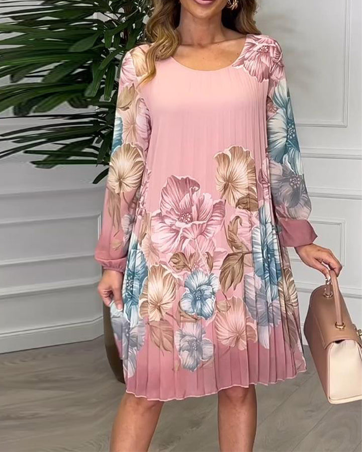 Ladies knee-length pleated chiffon dress with floral print, transparent sleeves and round neckline StylebySassy
