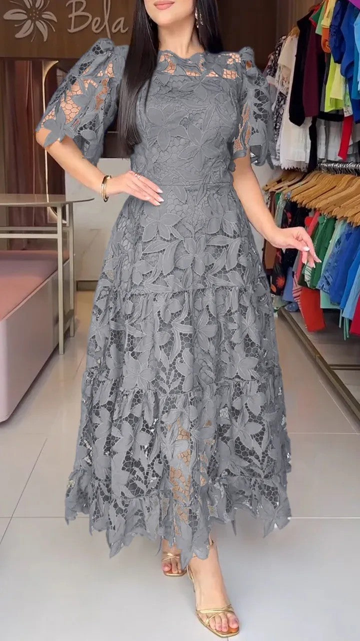 Women's maxi dress made of floral guipure lace with a fitted silhouette and tiered hem StylebySassy