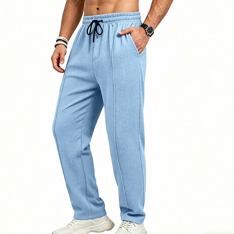 Men's straight-cut relaxed trousers with decorative center seam, elasticated drawstring waistband and side pockets StylebySassy