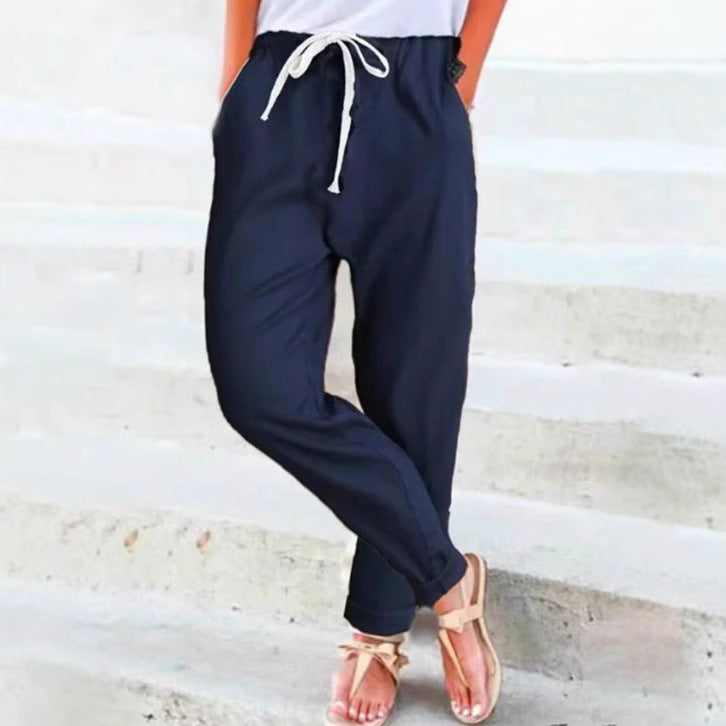 Women's light linen blend pants with elastic waistband, drawstring, and tapered ankle section StylebySassy