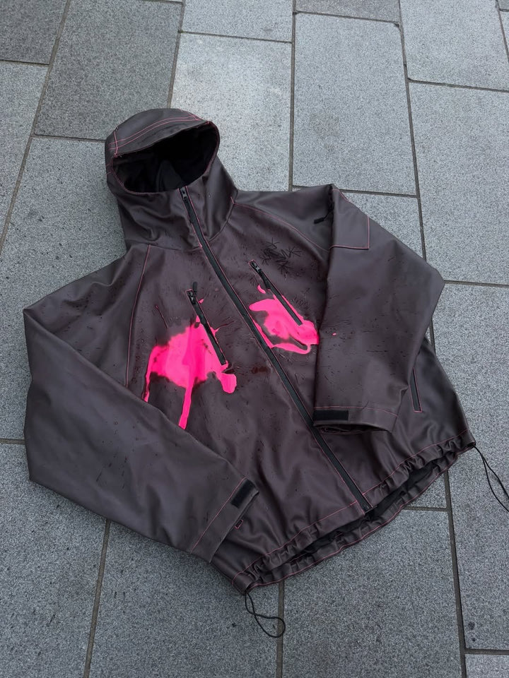 Women's nan waterproof hoodie jacket with splash print design, vertical zippered pockets, and adjustable hem StylebySassy
