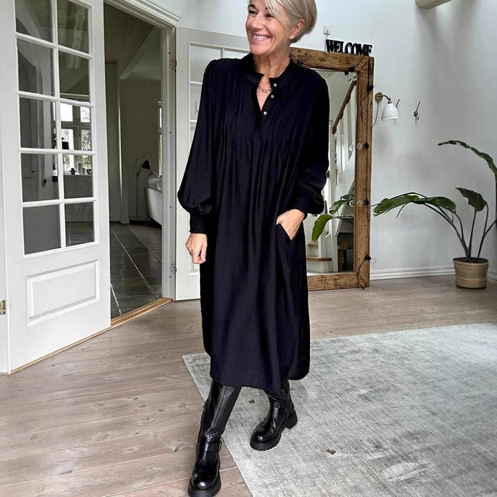 Ladies' loose midi dress with fine pleated look, stand-up collar, short button placket, smocked cuffs, and side pockets StylebySassy