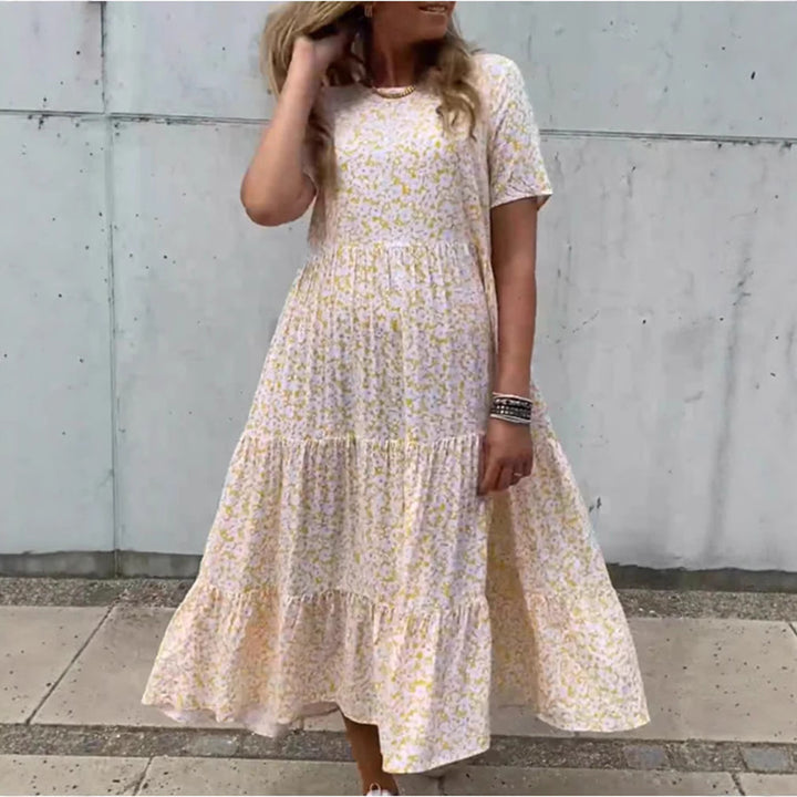 Women's flowing tiered maxi dress in Boho babydoll style with gathered underbust and short sleeves StylebySassy