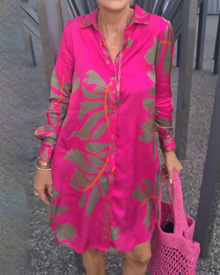 Women's loose falling shirt dress with continuous button placket, shirt collar, cuffs, and large botanical print StylebySassy
