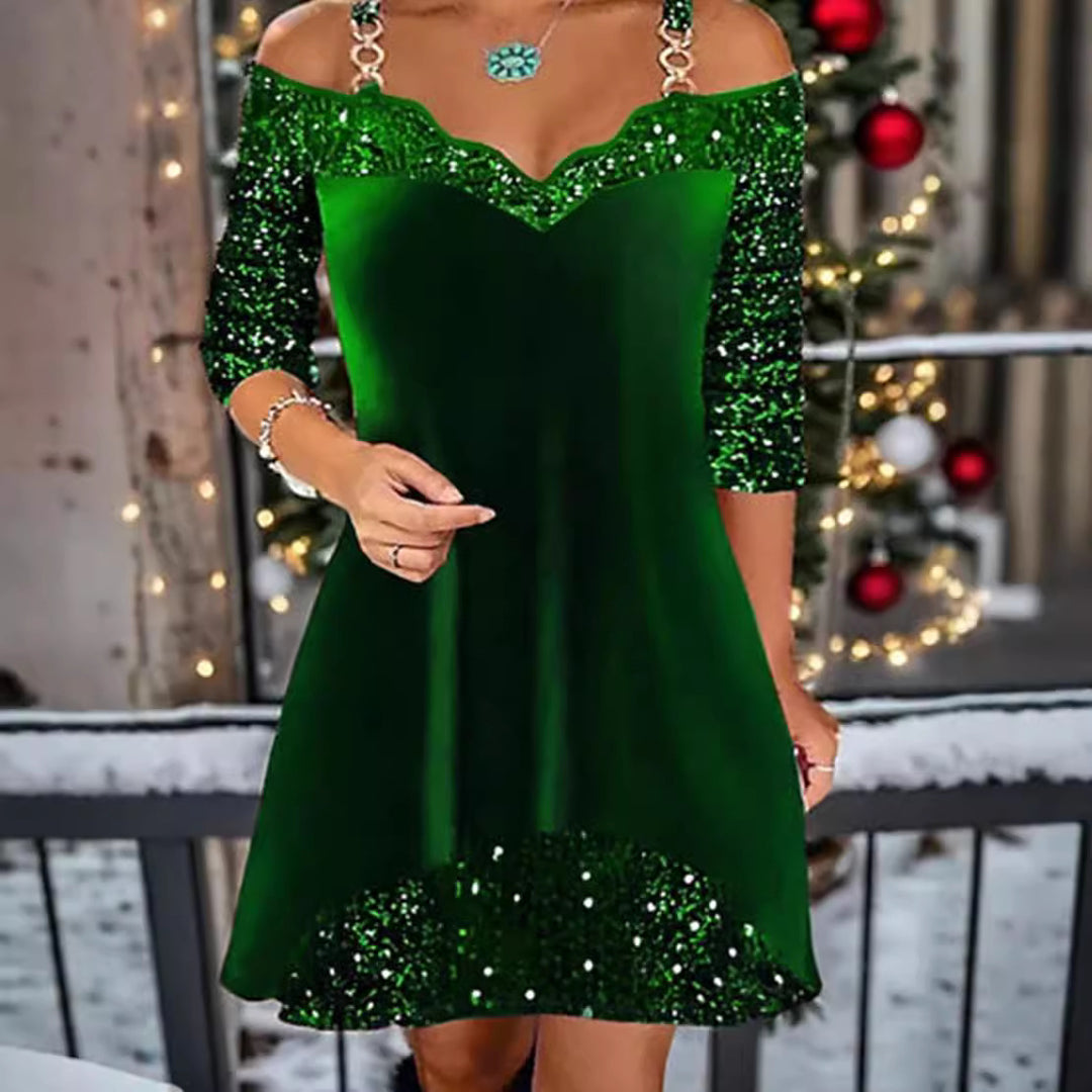 Women's off-shoulder sequin swing dress with delicate chain straps, elbow-length sleeves, and ruffle trim StylebySassy