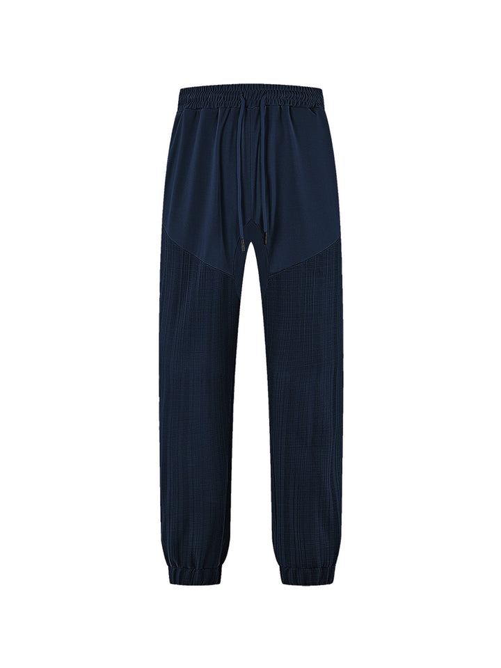 Men's slim-fit jogging pants with elastic drawstring waistband and textured knee panel StylebySassy