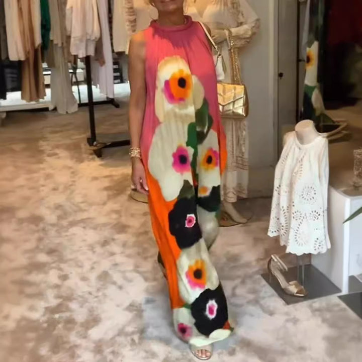 Women's sleeveless maxi dress with ruffled high collar, wide palazzo cut, and large floral print StylebySassy