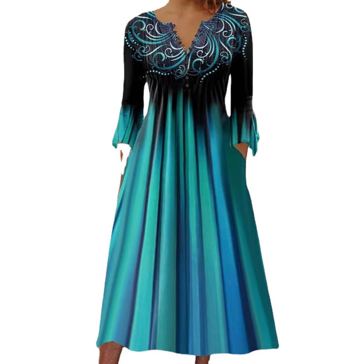 Women's flowing maxi dress with embellished V-neck, underbust seam, flared skirt and side pockets StylebySassy