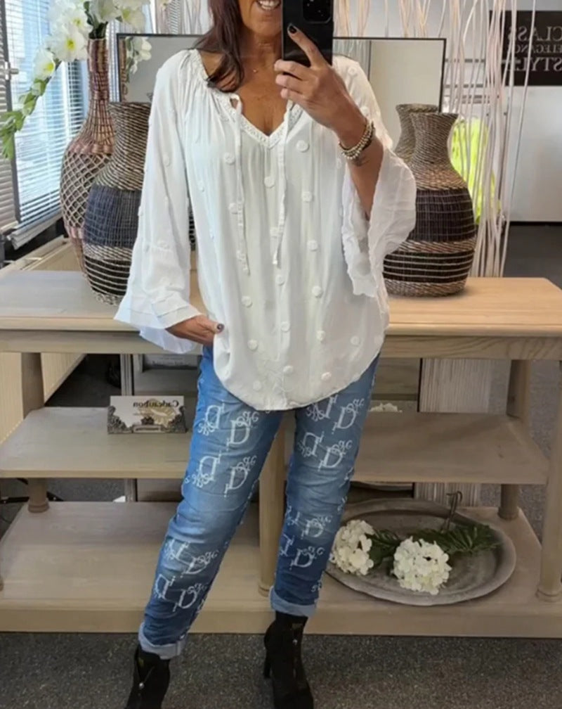 Women's lightweight Boho tunic with V-neck, three-dimensional dot texture and ruffle bell sleeves StylebySassy