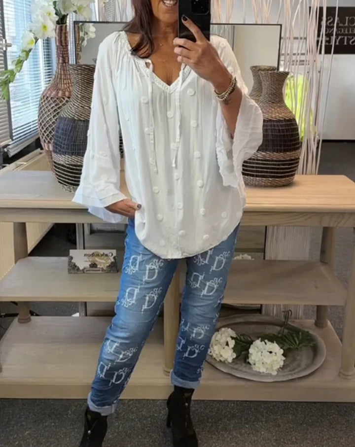 Women's lightweight Boho tunic with V-neck, three-dimensional dot texture and ruffle bell sleeves StylebySassy