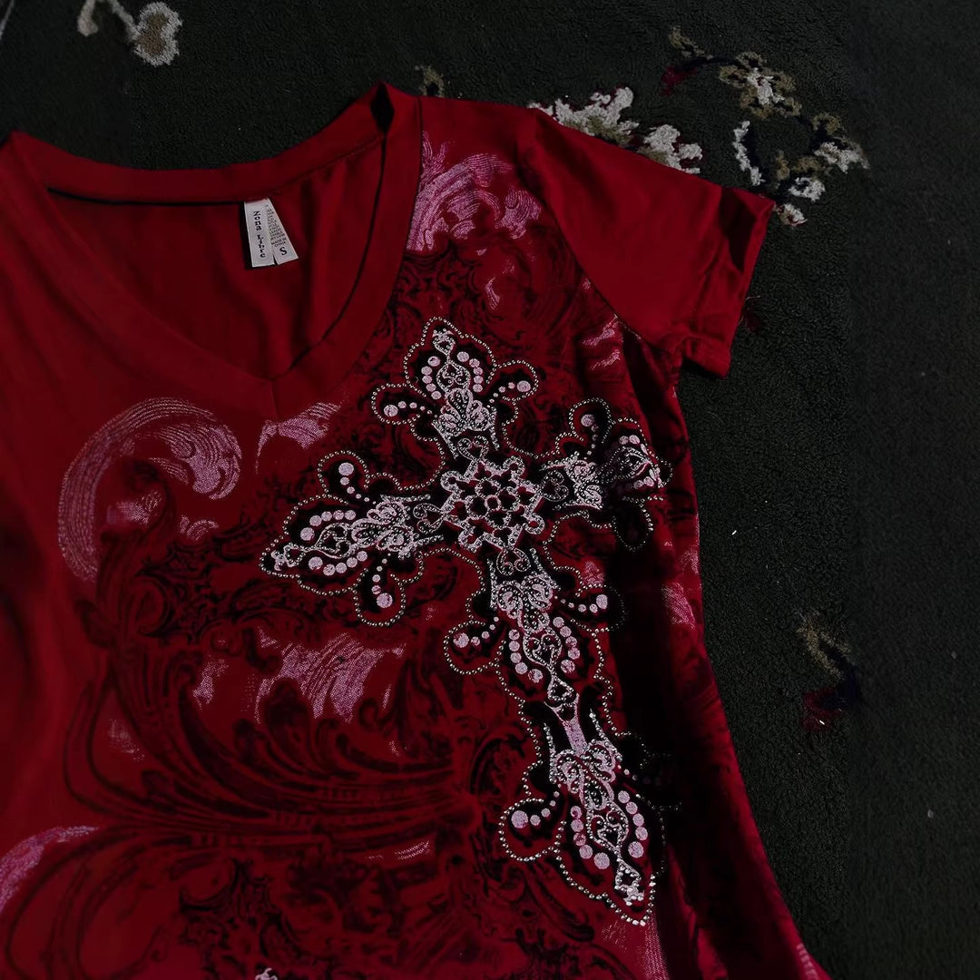 Women's T-shirt with decorative cross design and floral accents StylebySassy