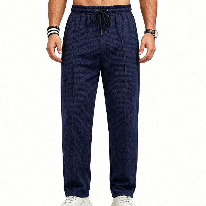 Men's straight-cut relaxed trousers with decorative center seam, elasticated drawstring waistband and side pockets StylebySassy