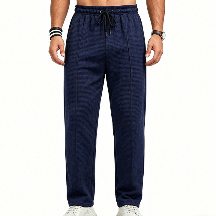 Men's straight-cut relaxed trousers with decorative center seam, elasticated drawstring waistband and side pockets StylebySassy