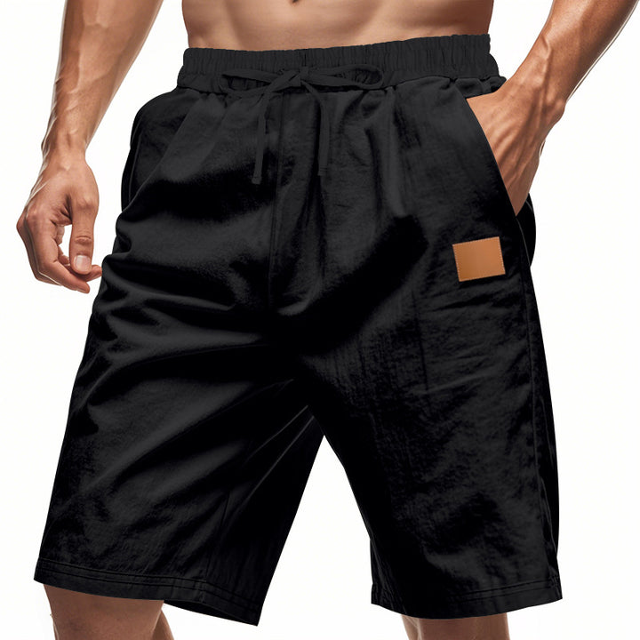Men's lightweight casual Bermuda shorts with elastic waistband, drawstring and discreet leather application StylebySassy