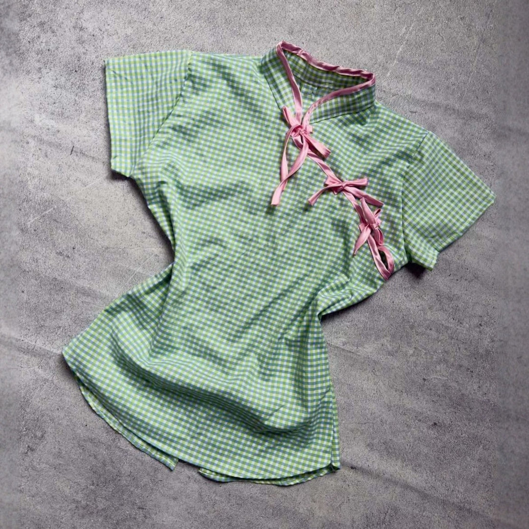 Women’s Chinese short-sleeve shirt with playful check pattern and decorative bows