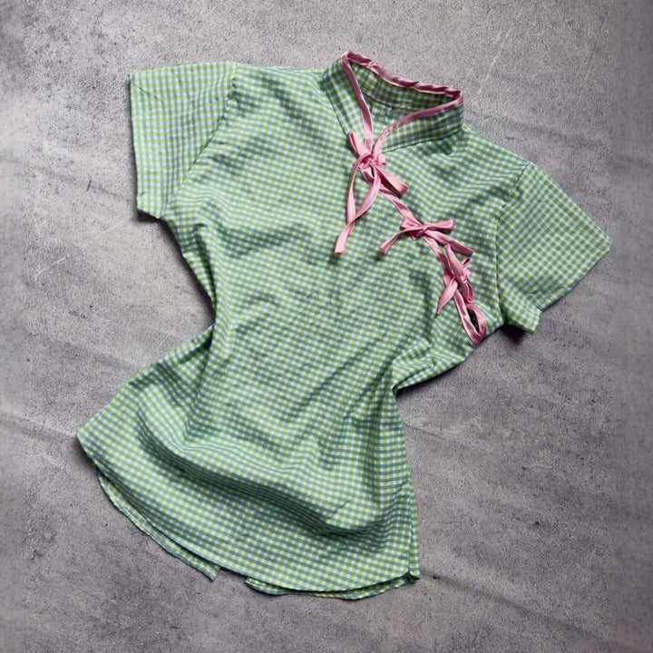 Women’s Chinese short-sleeve shirt with playful check pattern and decorative bows