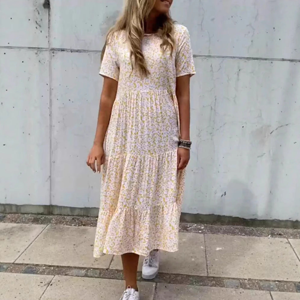 Women's flowing tiered maxi dress in Boho babydoll style with gathered underbust and short sleeves StylebySassy