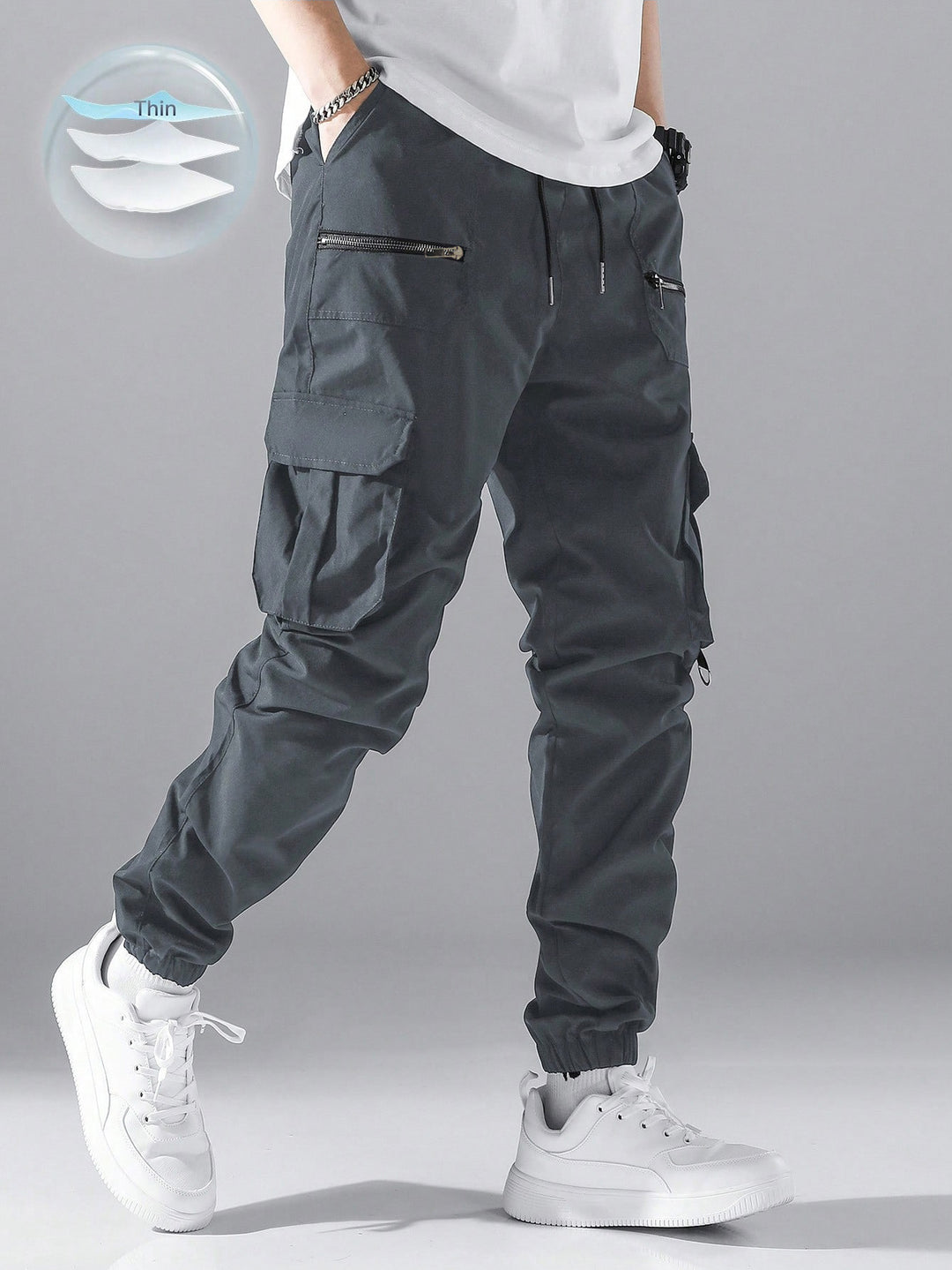 Men's slim cargo joggers with multiple zippered pockets, elastic ankle cuff, and drawstring StylebySassy