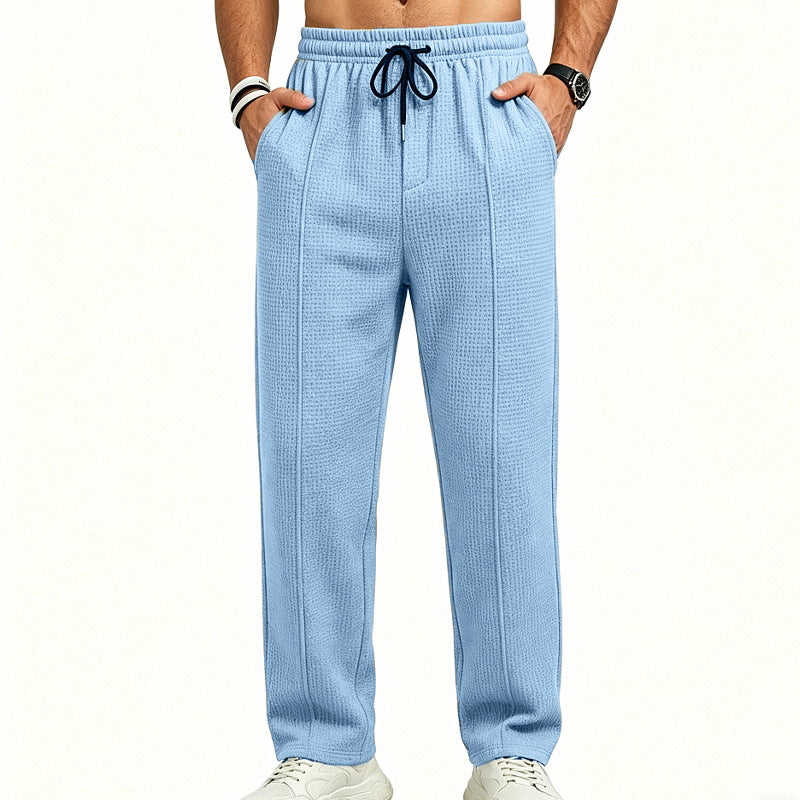 Men's straight-cut relaxed trousers with decorative center seam, elasticated drawstring waistband and side pockets StylebySassy