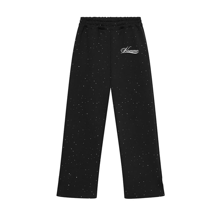 Men's wide comfort trousers with straight leg, elastic drawstring waistband, subtle logo embroidery, and fine speckled look StylebySassy