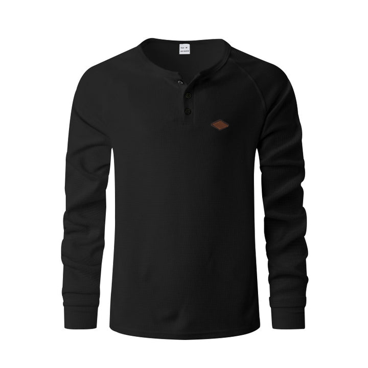 Men's structured long-sleeve shirt with short button placket, raglan sleeves, and subtle logo application StylebySassy