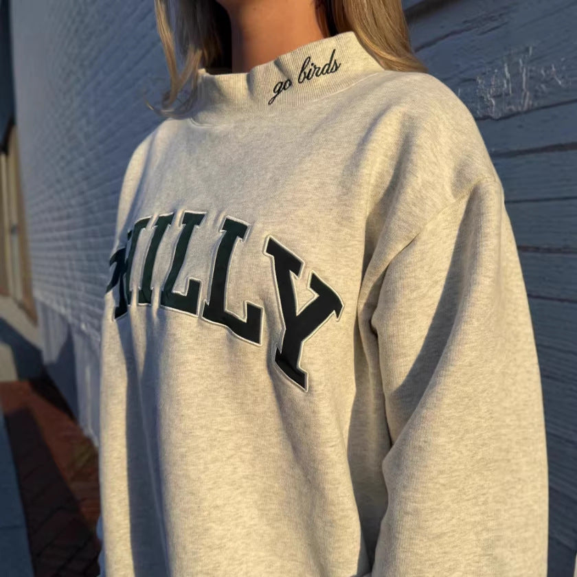 Women's oversized college sweatshirt with high stand-up collar and sewn-on lettering StylebySassy