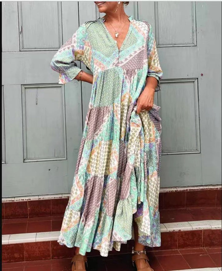 Women's airy maxi dress in patchwork boho style with V-neck, gathered bodice, and flared tiered hem StylebySassy