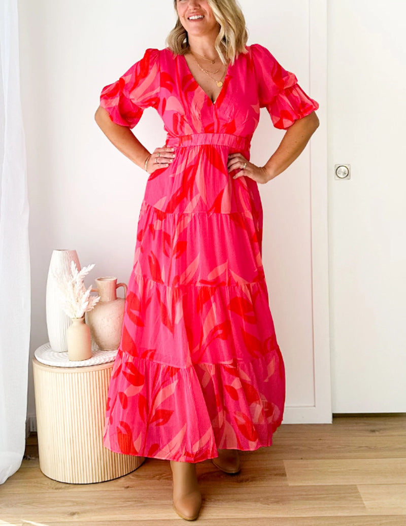 Ladies' flared maxi dress with V-neck, elastic underbust seam, and tiered skirt StylebySassy