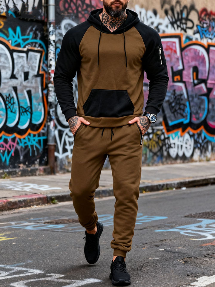 Men's two-piece hooded sweat set with raglan sleeves, sleeve zip pocket, and tapered jogging pants StylebySassy