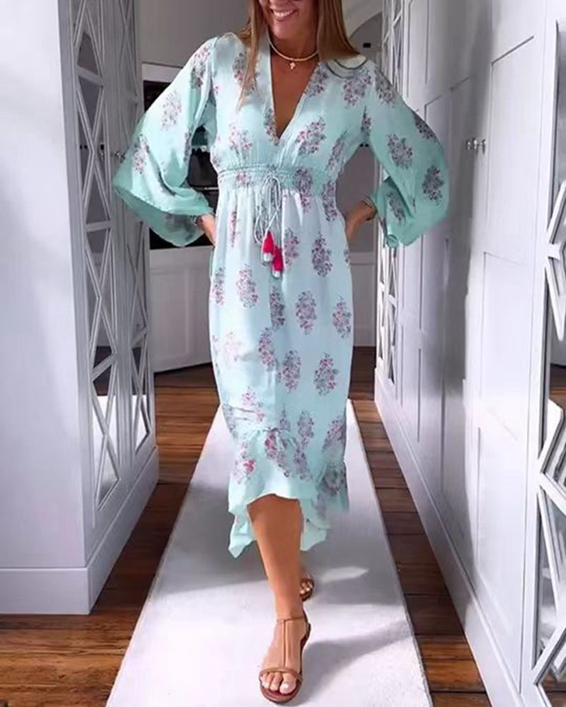 Women’s airy-flowing Boho midi dress with V-neck, gathered smock waist, drawstring with tassels, and asymmetrical ruffled hem StylebySassy